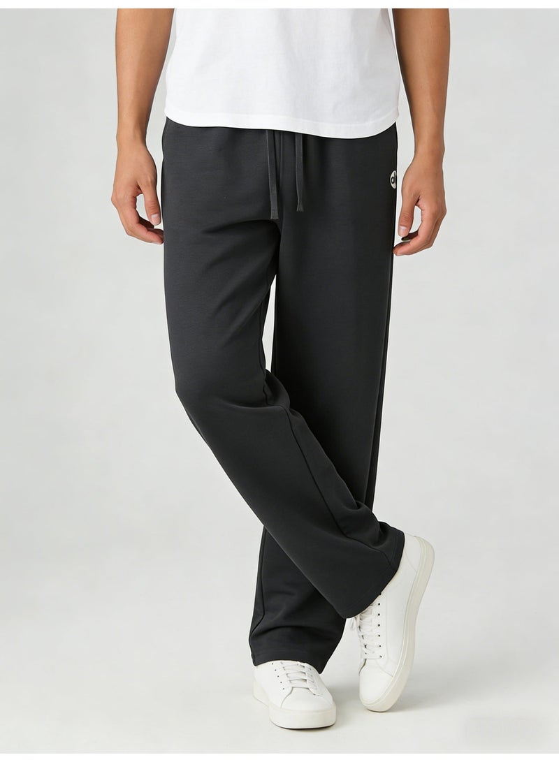 Alo Yoga Ultra-Soft High-Waisted Wide-Leg Track Pants in Charcoal - Image 5